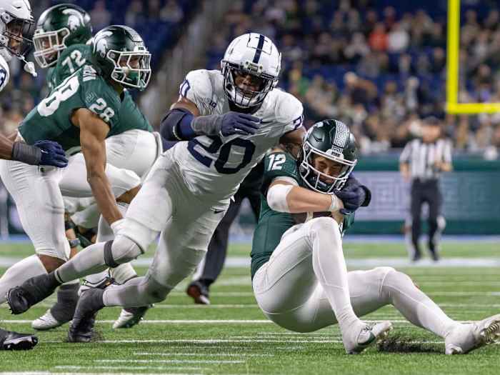 Nov 24, 2023; Detroit, Michigan, USA; Penn State Nittany Lions defensive end Adisa Isaac (20) pressures and sacks Michigan State Spartans quarterback Katin Houser (12) during the second half at Ford Field. Mandatory Credit: David Reginek-USA TODAY Sports